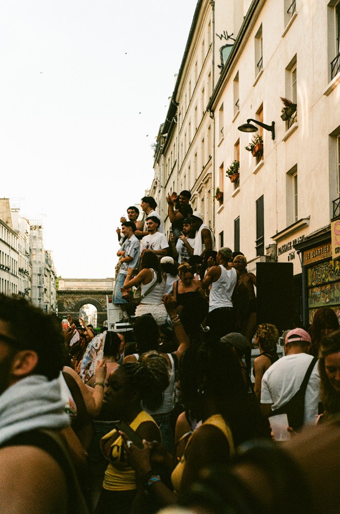 Crowd celebrating along a city street