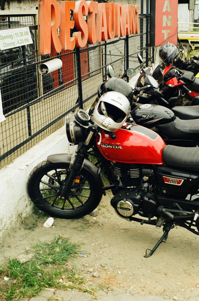 Red motorcycle outside a restaurant