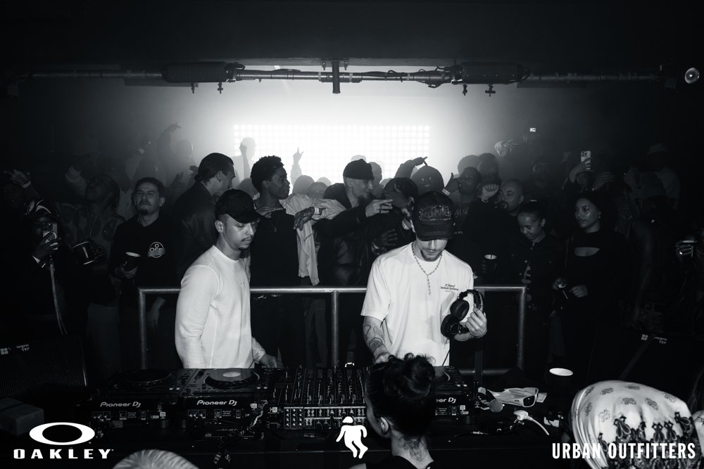 DJs with the crowd behind them at the Oakley and Urban Outfitters event