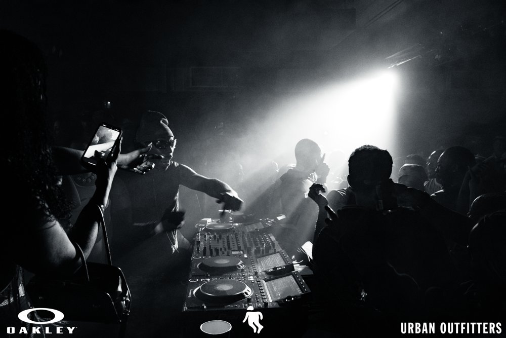 DJ performing beside the crowd at the Oakley and Urban Outfitters event